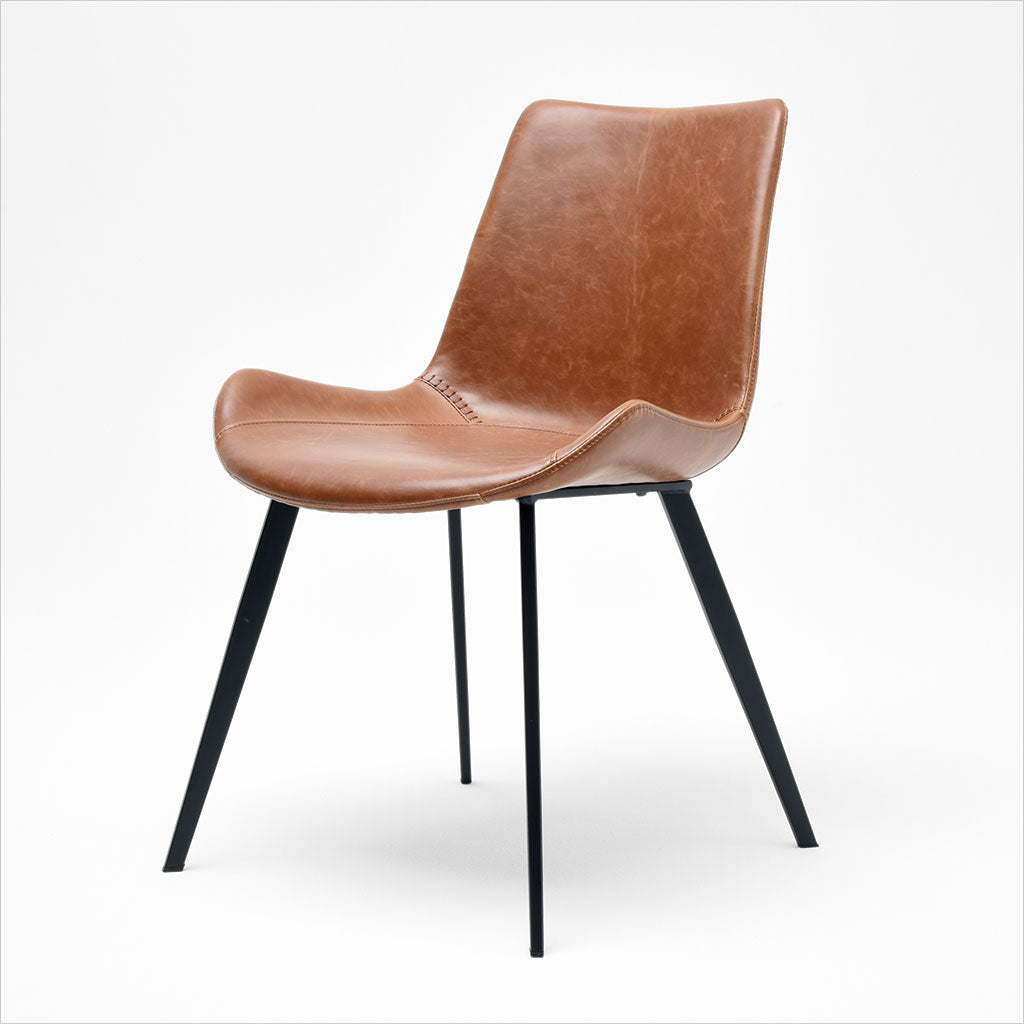 dining chair with baseball stitching along edges and curves