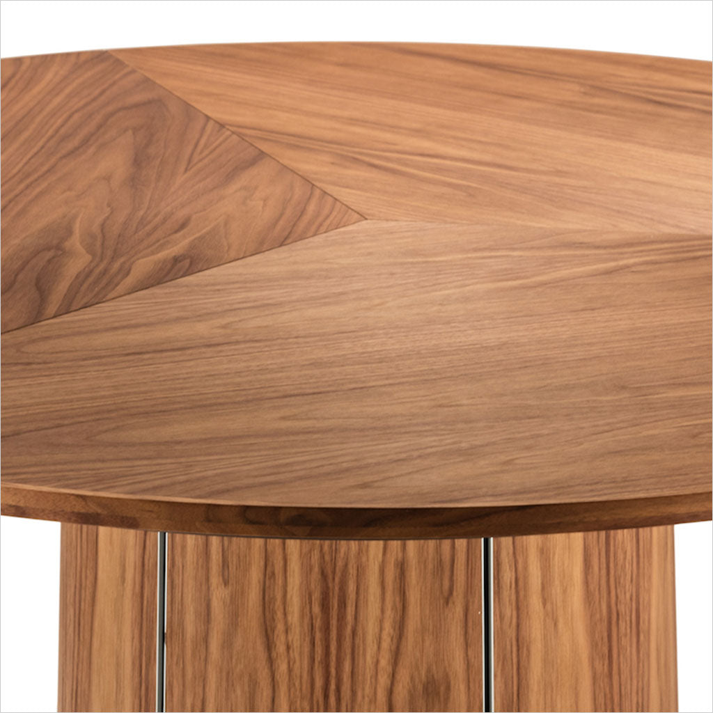 round dining table with extension leaves and pedestal base