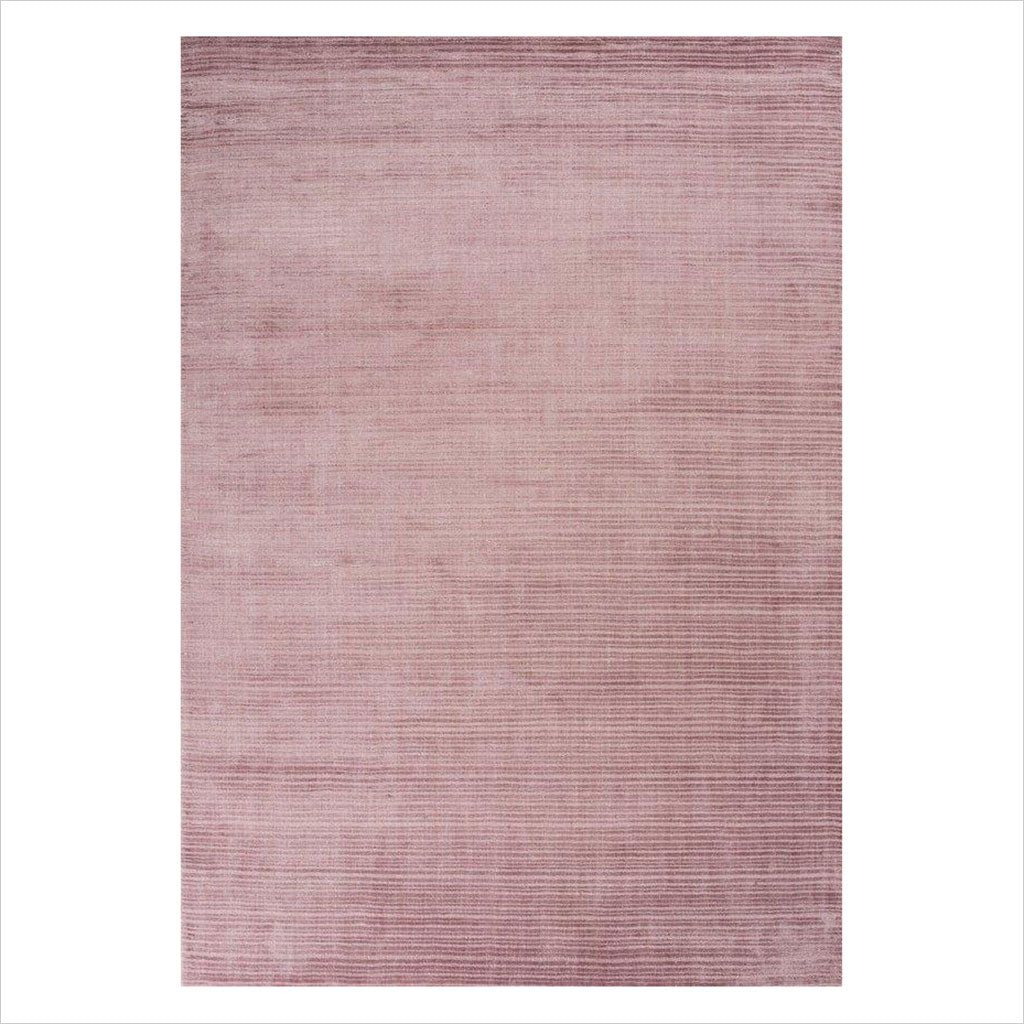 hand-loomed area rug in rose color