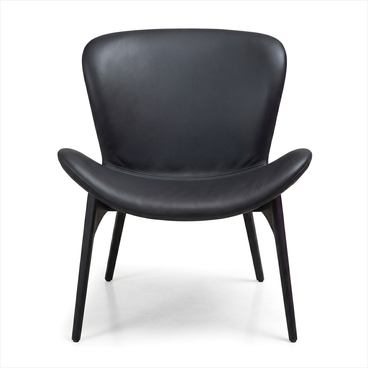 A modern black leather lounge chair with a curved backrest, integrated armrests, and four tapered legs, shown against a plain white background.