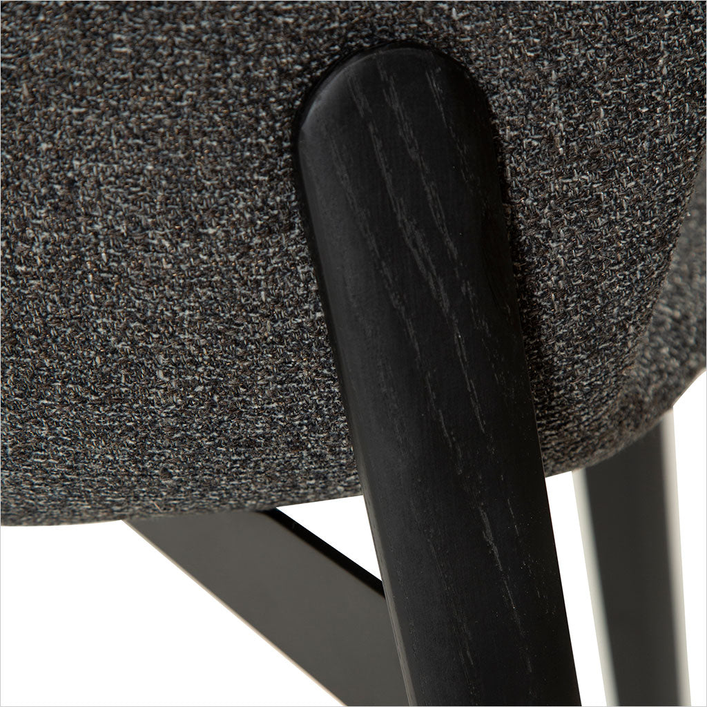grey fabric dining chair with black legs