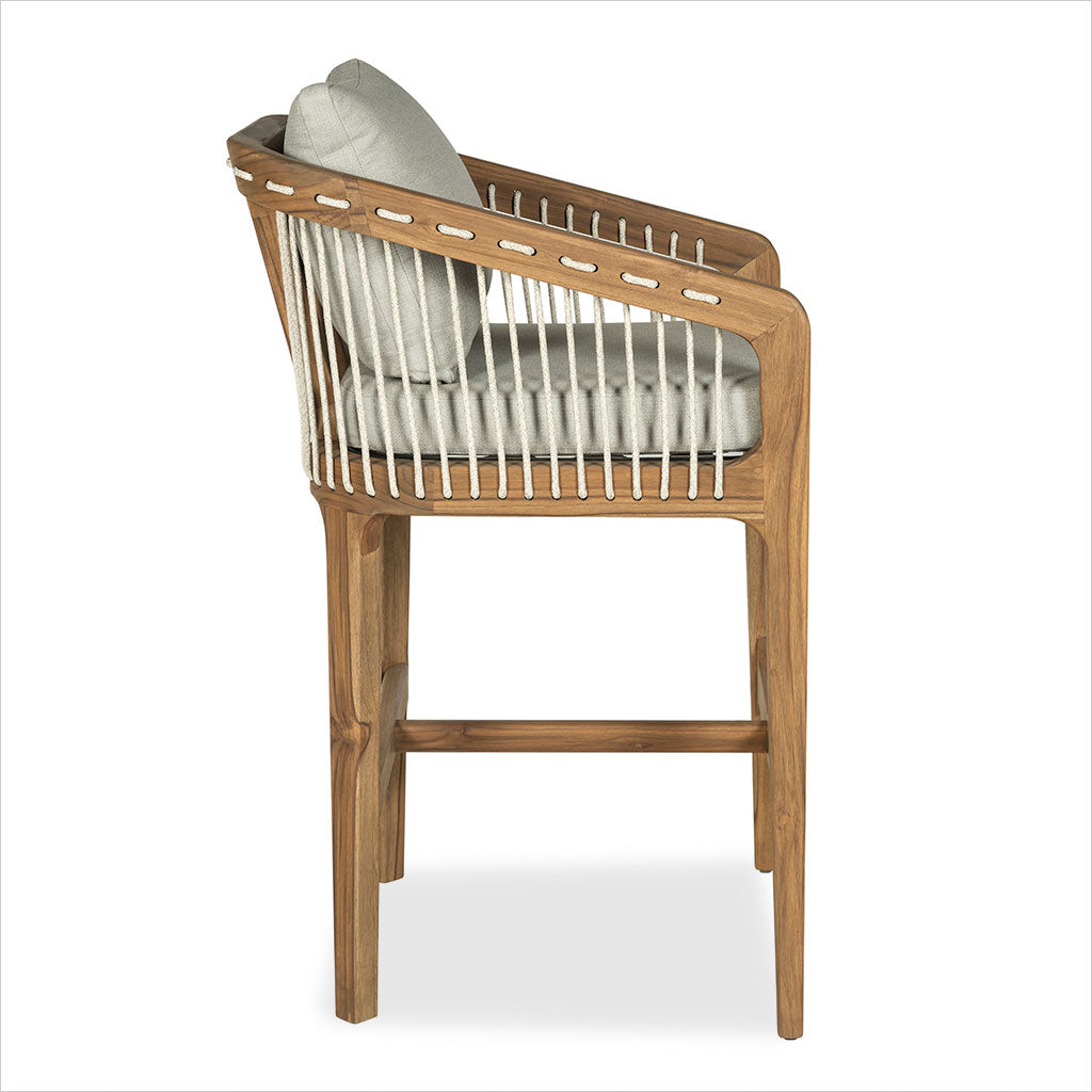 Barstool in teak wood with beige seat and back cushions on a white background