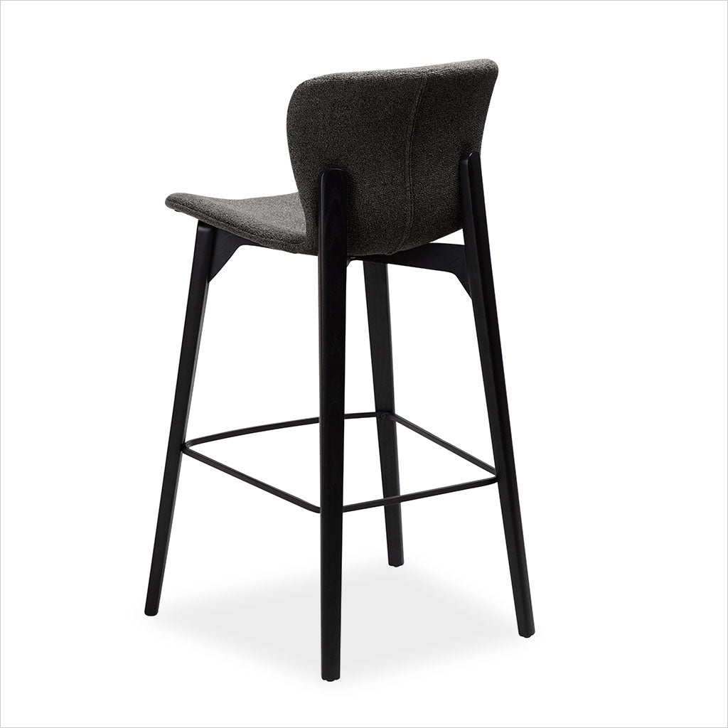 grey fabric counter stool with black legs