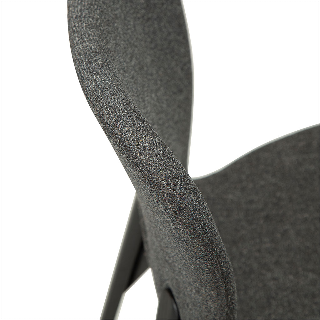 grey fabric dining chair with black legs