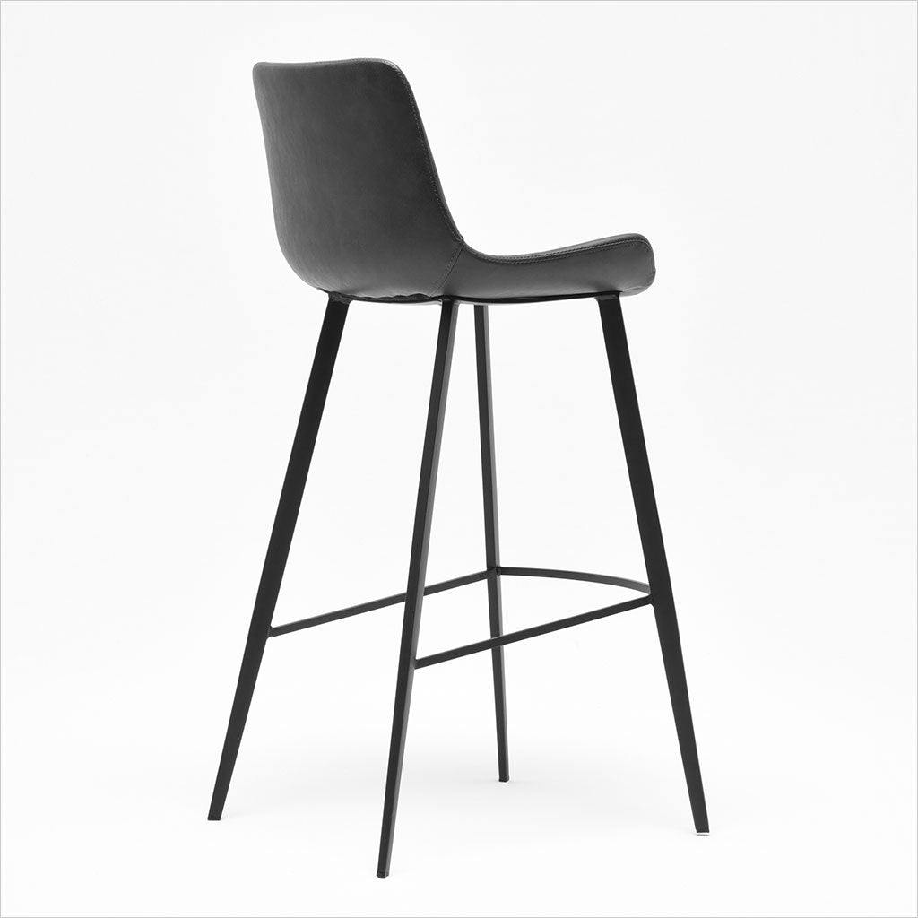 barstool with baseball stitching along edges and curves