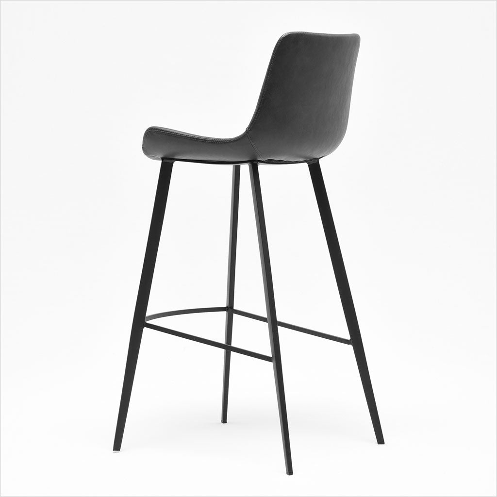 barstool with baseball stitching along edges and curves