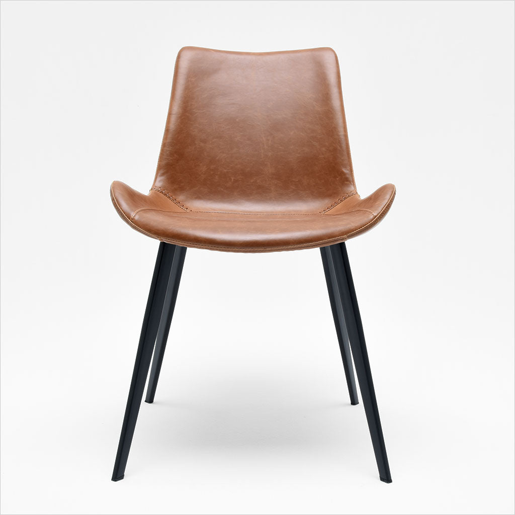 dining chair with baseball stitching along edges and curves