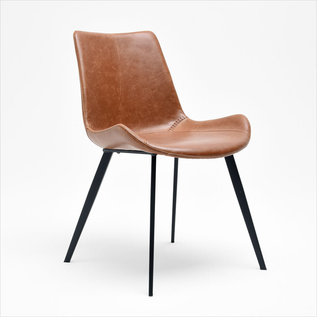 dining chair with baseball stitching along edges and curves