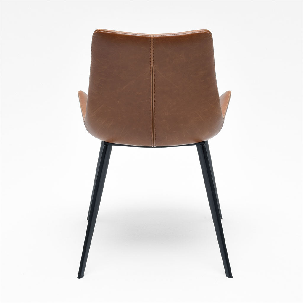 dining chair with baseball stitching along edges and curves