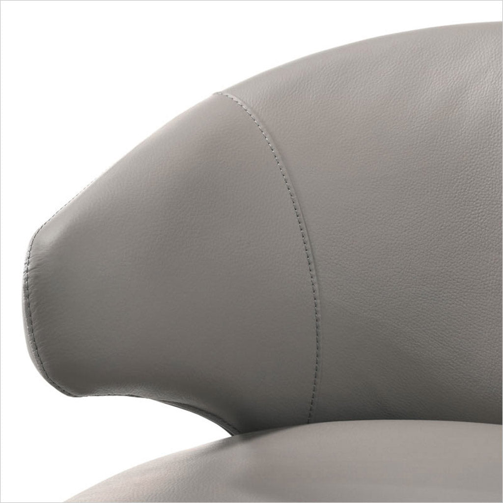 leather upholstered chair with arm and curved back