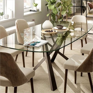 oval dining table with glass top and bronze coated metal base