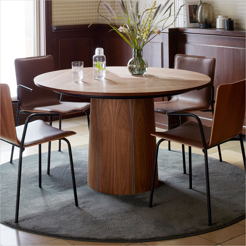 round dining table with extension leaves and pedestal base
