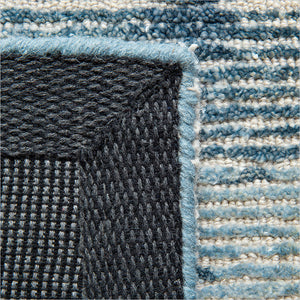 erode area rug in blue