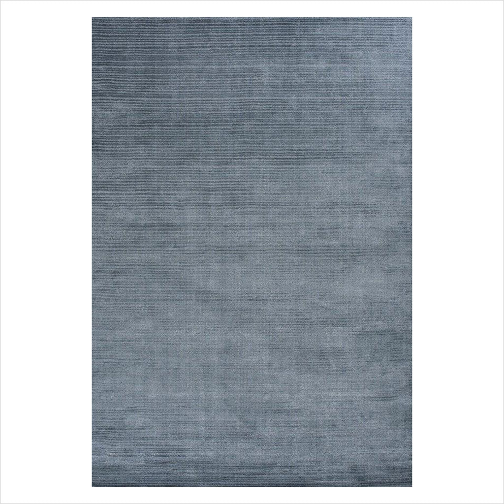 hand-loomed area rug in blue