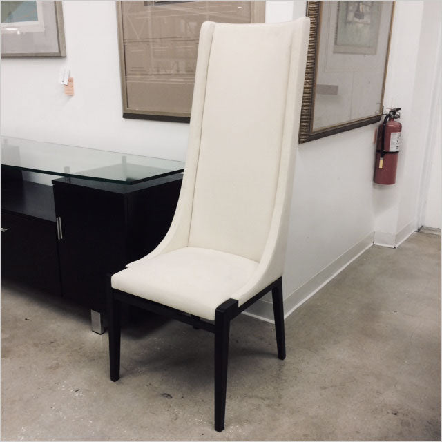 high back dining chair upholstered in white fabric