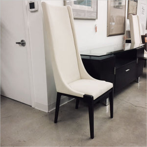 high back dining chair upholstered in white fabric