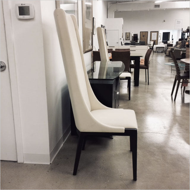high back dining chair upholstered in white fabric